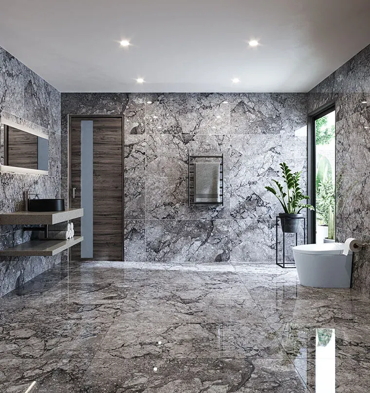 Baño con piso y paredes en piedra gris pulida